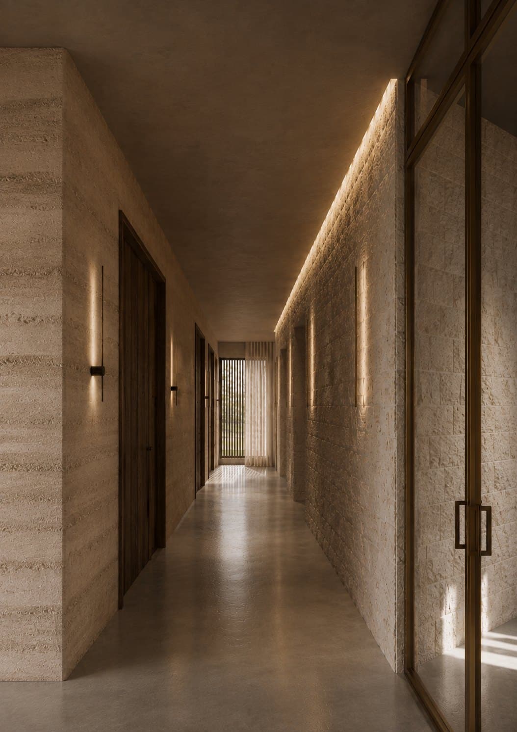 A narrow interior corridor with pale stone walls, dark wooden doors on one side, slim vertical wall lights, a polished floor and a bronze-framed glass wall on the other side.